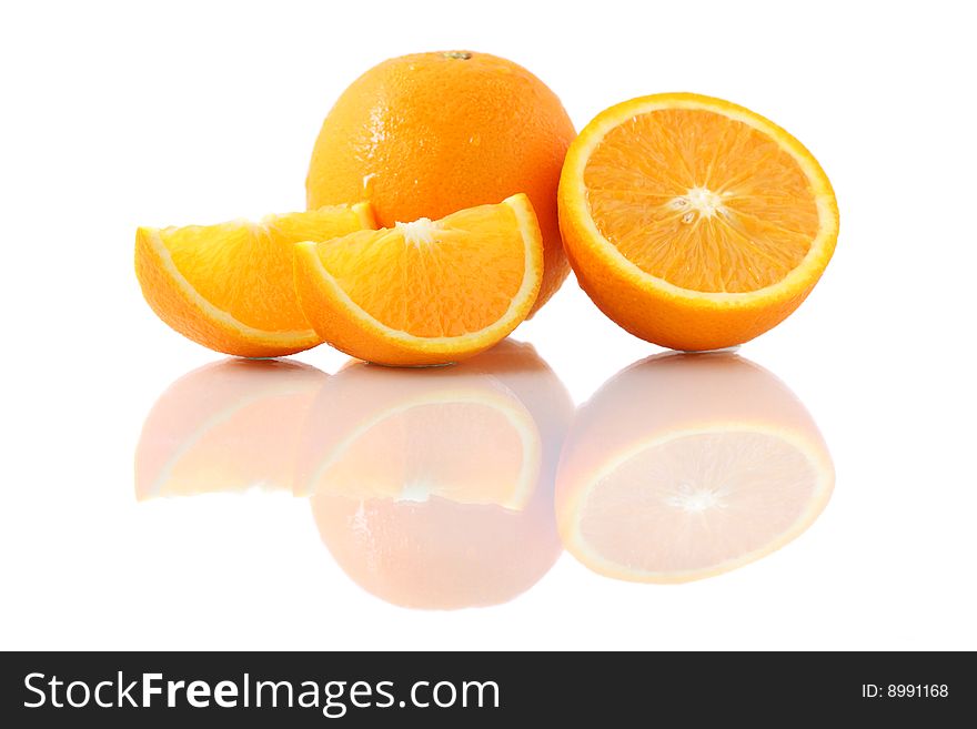 Orange pieces put together with fresh orange isolated on white background. Orange pieces put together with fresh orange isolated on white background.