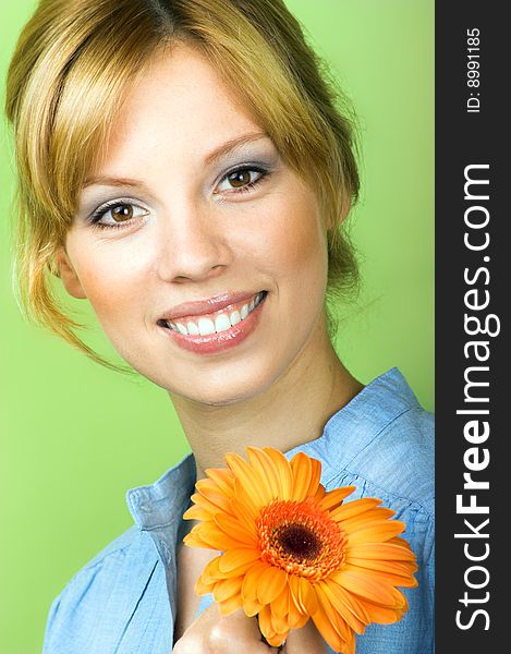 Beauty portrait of a young woman with a flower. Beauty portrait of a young woman with a flower