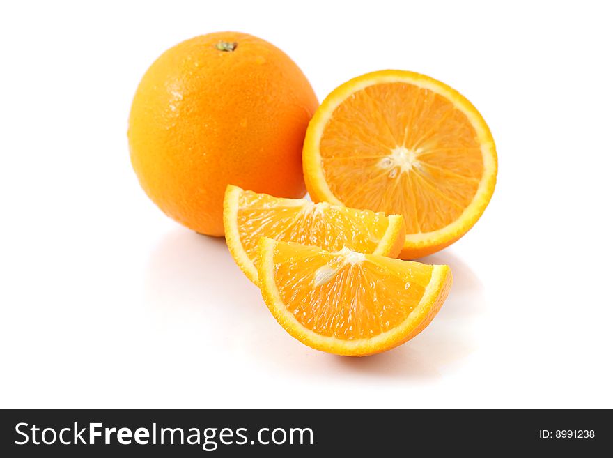 Orange pieces put together with fresh orange isolated on white background. Orange pieces put together with fresh orange isolated on white background.