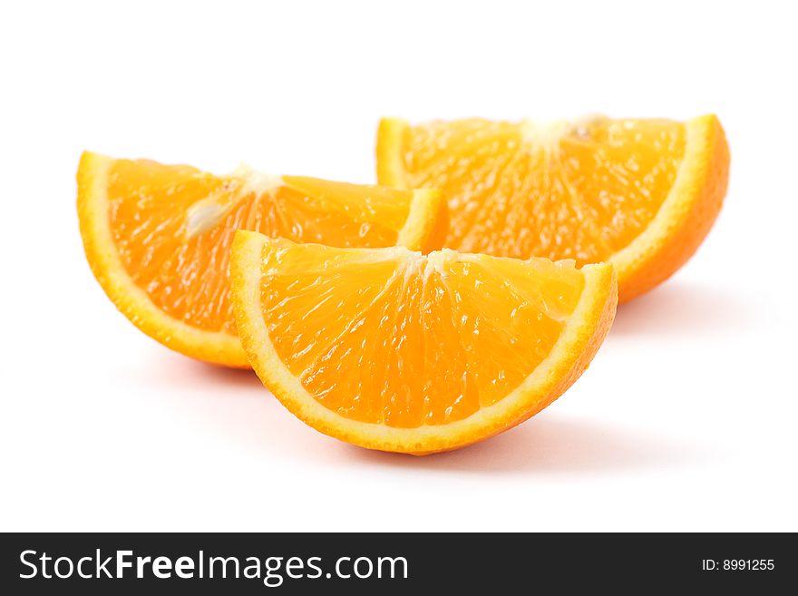 Orange pieces put together and isolated on white background. Orange pieces put together and isolated on white background.