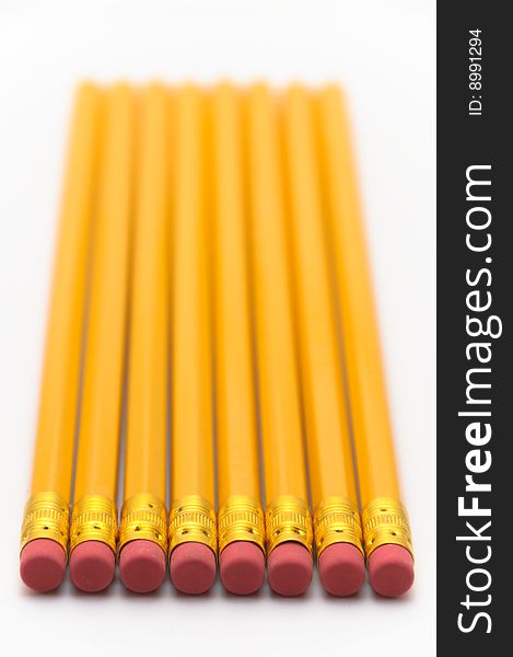 Aligned pencils viewed from the rubber