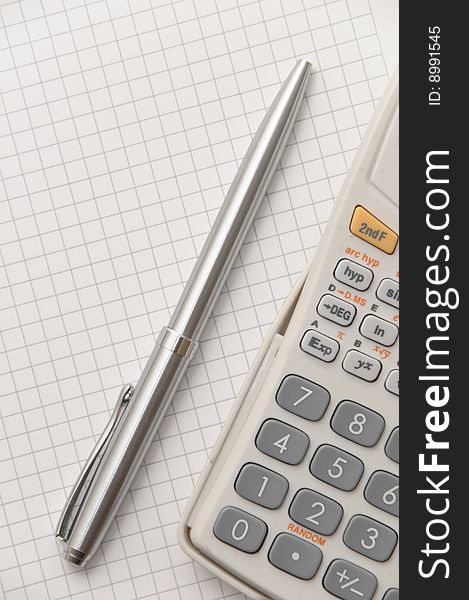 Elegant silver pen and scientific calculator on white blank page