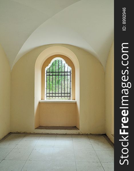 Catholic religious construction. Metal lattice at a window