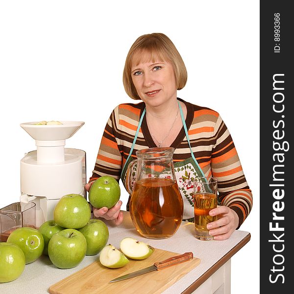 The young woman prepares for apple juice. The young woman prepares for apple juice