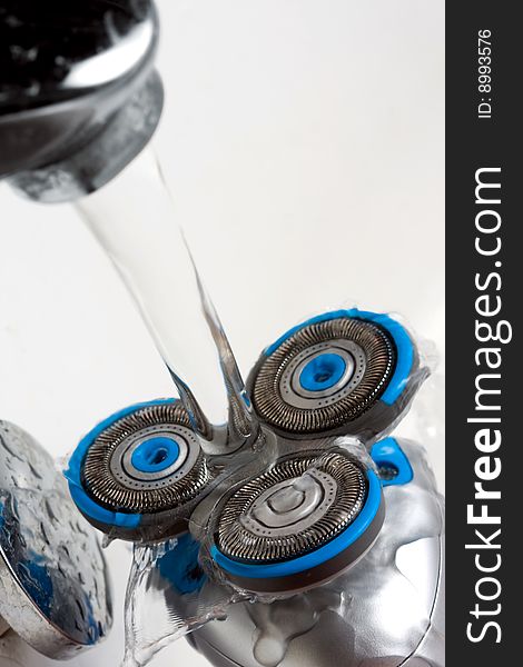 Macro Of Shaver Head Under Tap