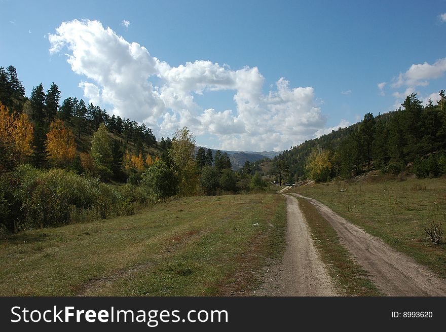 Walk on road in mountains autumn