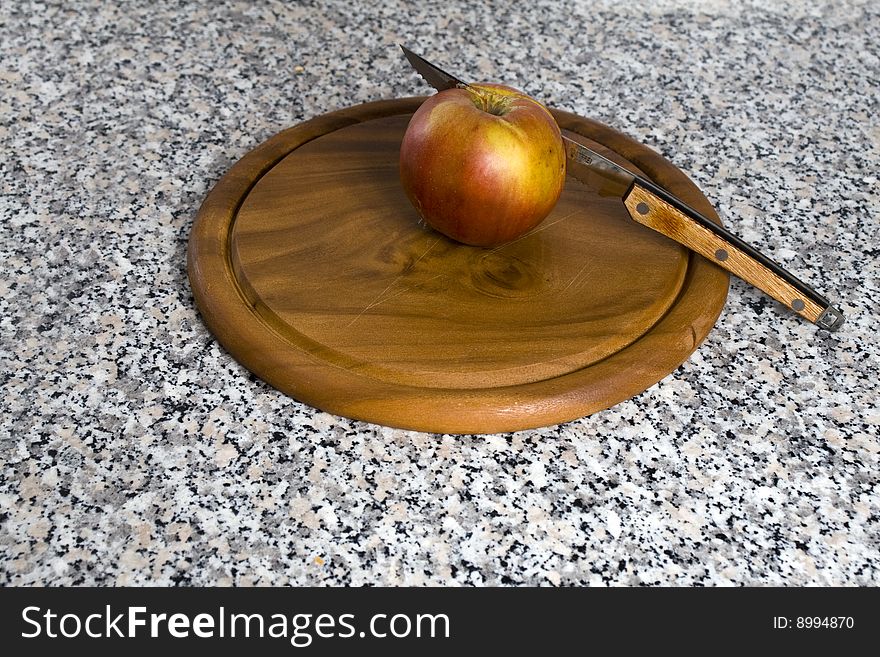 Apple on a cutting board. Apple on a cutting board