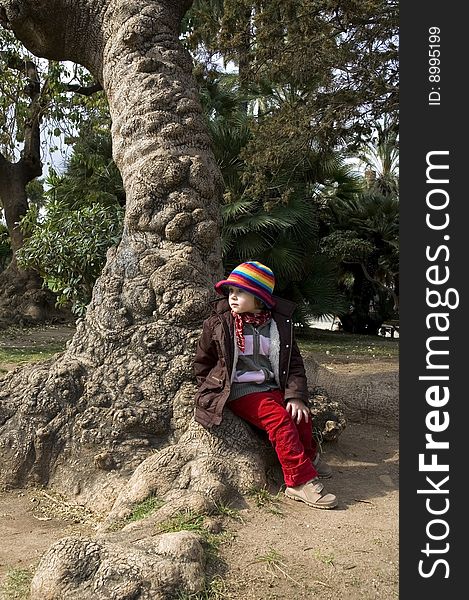 Portait of a sweet girl sitting in the park