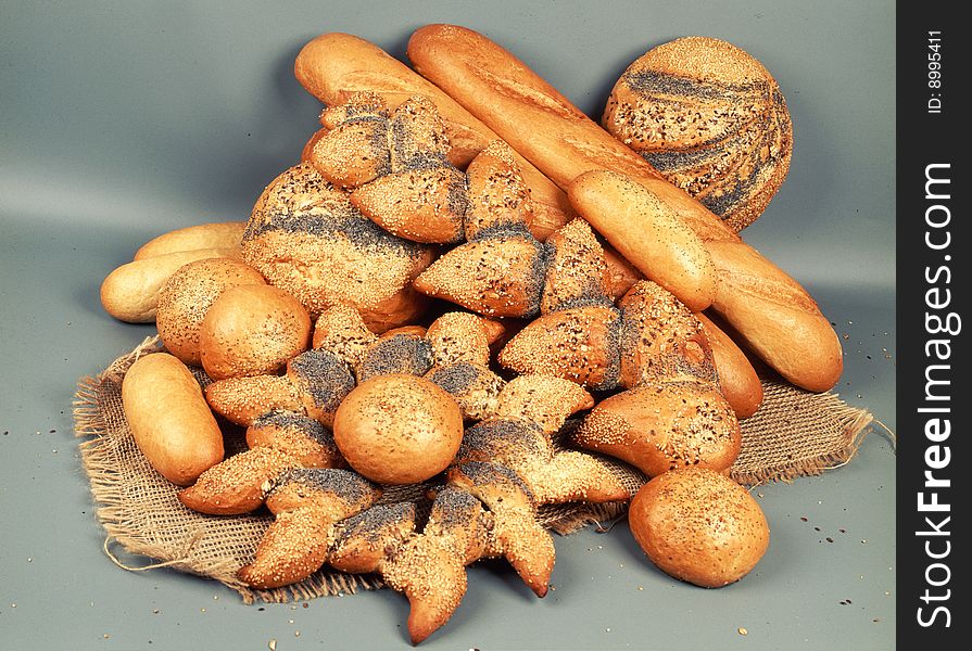 Diferent loaves of bread on light background