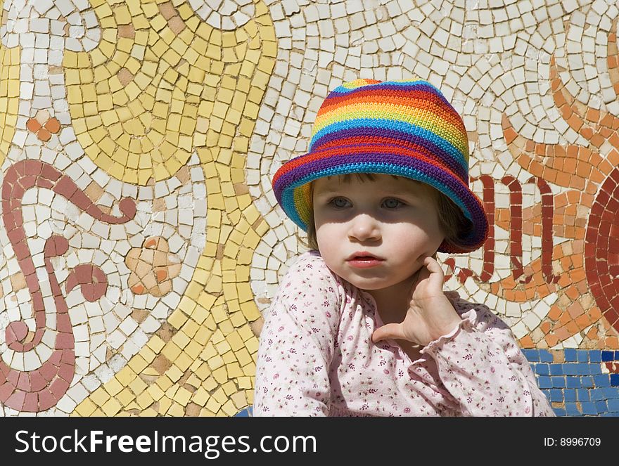 Portrait of a sweet girl with colourful mosaic