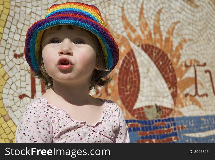 Portrait of a sweet girl with colourful mosaic
