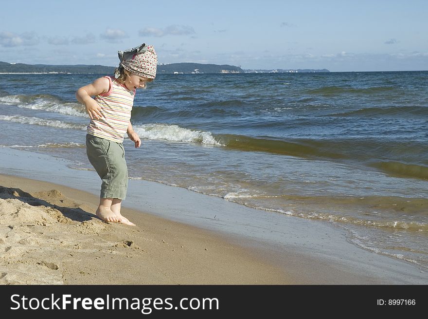 Sweet little girl on the beach. summertime. Sweet little girl on the beach. summertime