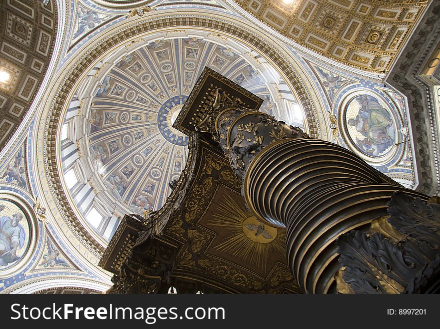 An image of Saint Peter cathedral's interior with sculpted bronze canopy designed by Gian Lorenzo Bernini. An image of Saint Peter cathedral's interior with sculpted bronze canopy designed by Gian Lorenzo Bernini