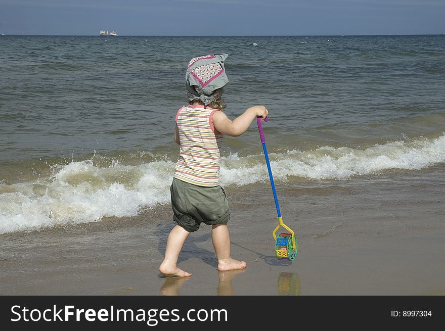 Sweet little girl on the beach. summertime. Sweet little girl on the beach. summertime