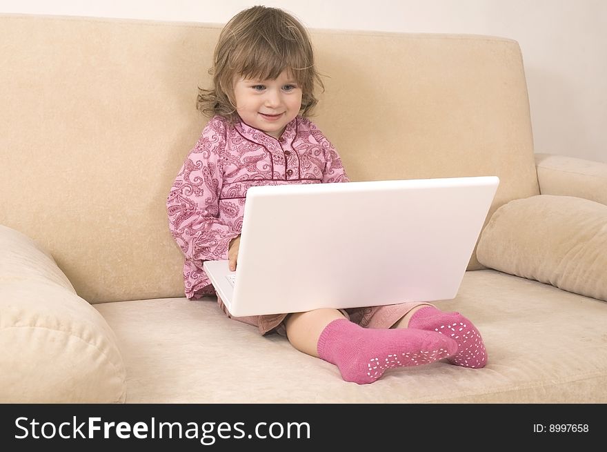 Young girl using a laptop. computer generation