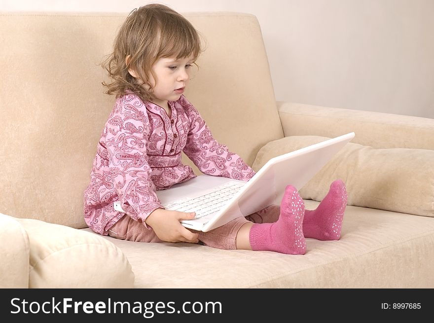 Young girl using a laptop. computer generation