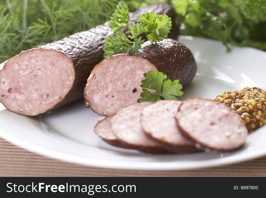 Detail of sausages with herbs