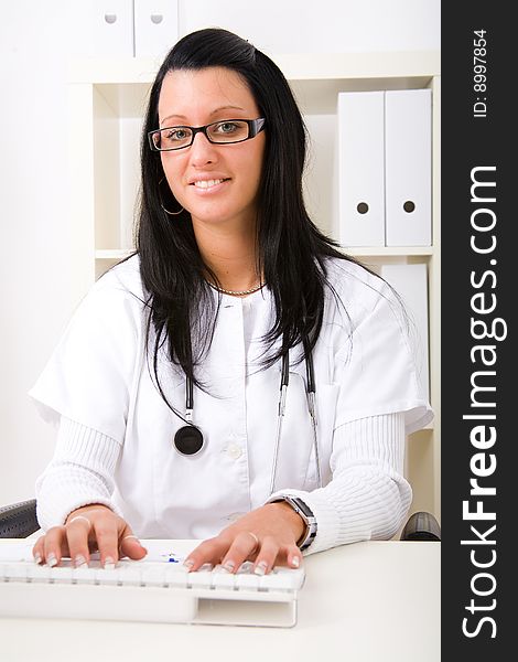 Beautiful young doctor in doctor's office