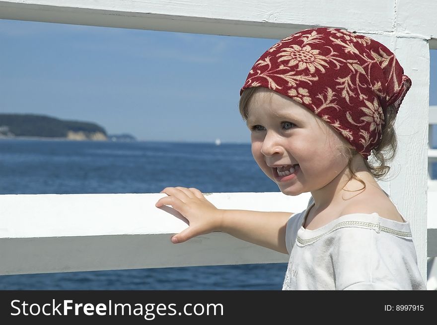 Beach day. little girl looking at the water. Beach day. little girl looking at the water