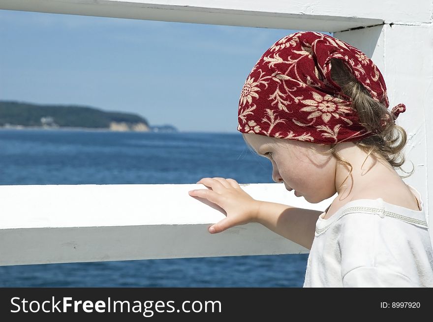 Beach day. little girl looking at the water. Beach day. little girl looking at the water