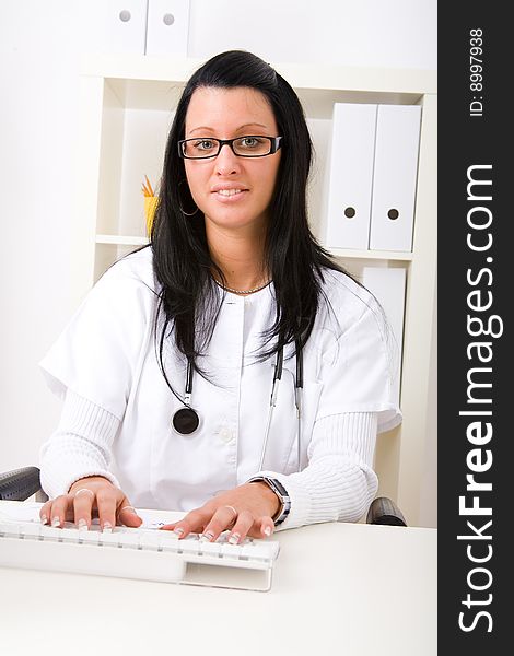 Beautiful young doctor in doctor's office