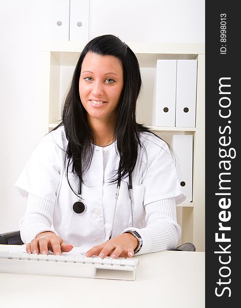 Beautiful young doctor in doctor's office