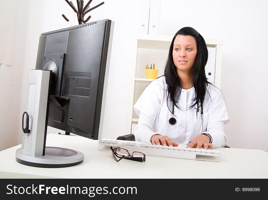 Beautiful young doctor in doctor's office