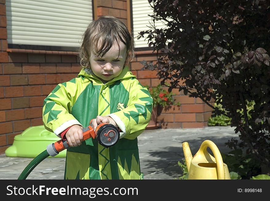 Girl watering the garden. water fight