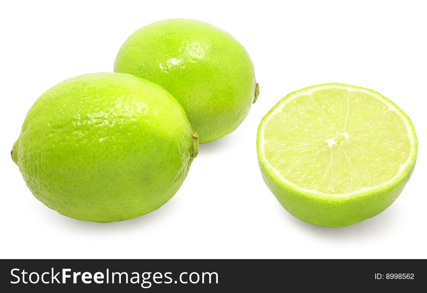 Fresh green limes isolated over white with clipping path