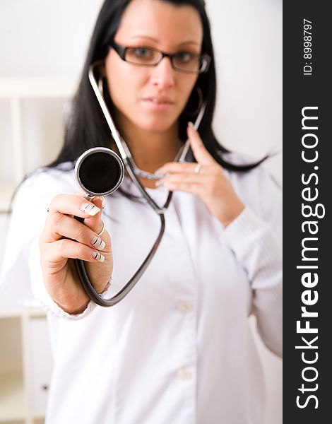 Beautiful young doctor in doctor's office