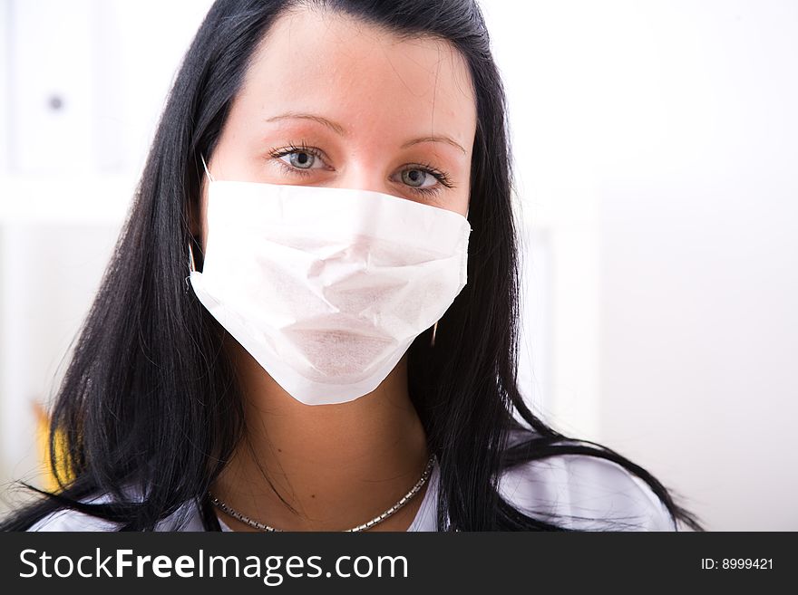 Beautiful young doctor in doctor's office