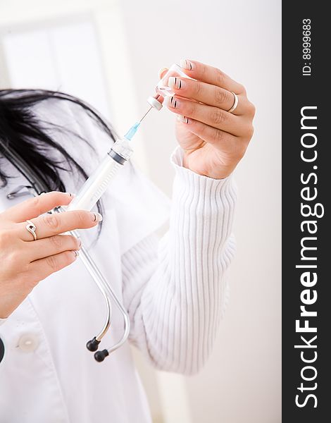 Beautiful young doctor in doctor's office