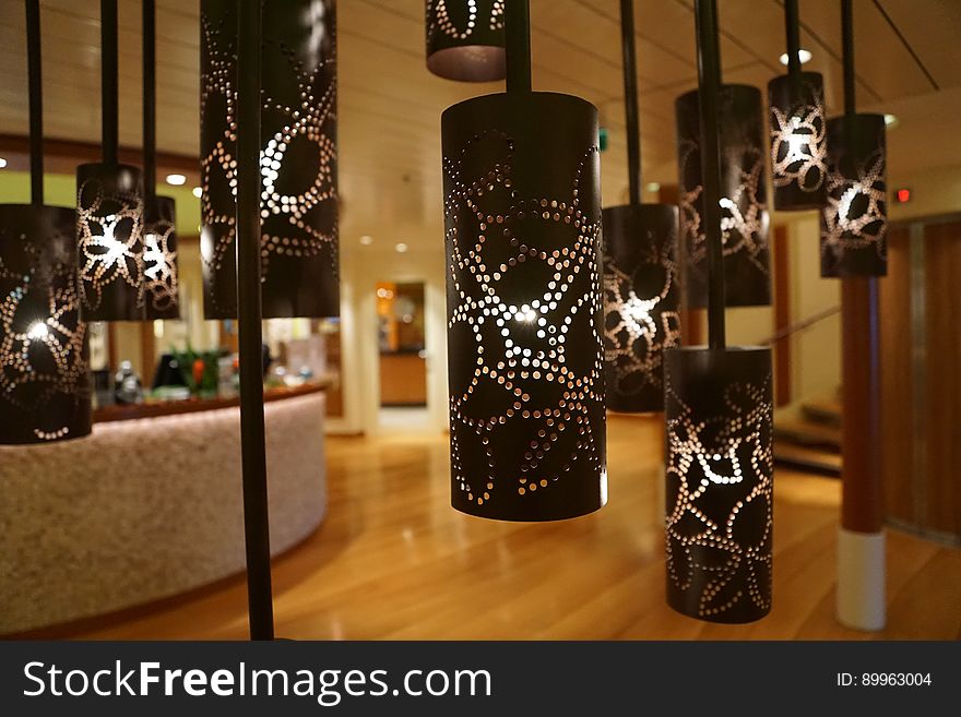 Lamps hanging from ceiling with cylindrical shades. Lamps hanging from ceiling with cylindrical shades.