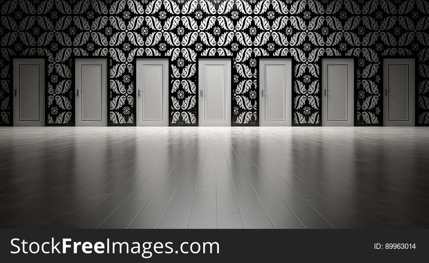 A room with many doors and decorative wallpaper. A room with many doors and decorative wallpaper.