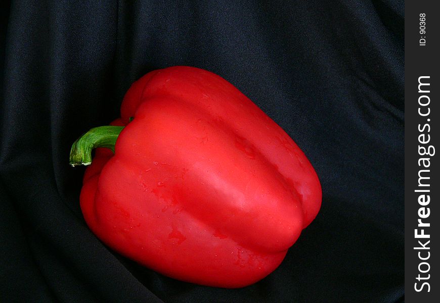 Isolation of red bell pepper on black