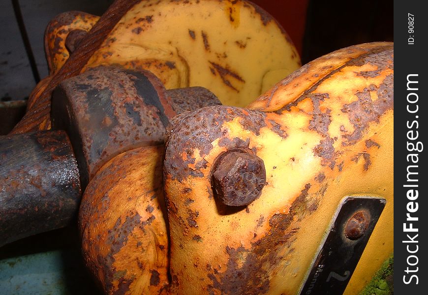 Close-up of an old factory appliance. Rusted nuts & bolts show. Close-up of an old factory appliance. Rusted nuts & bolts show.