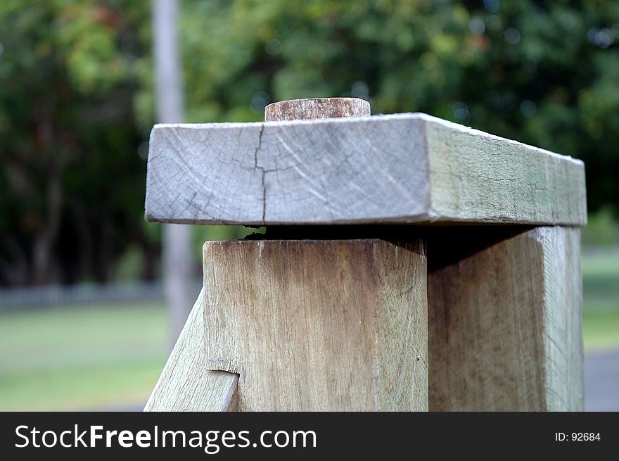 Close up of a vintage style hardwood gate hinge. Close up of a vintage style hardwood gate hinge.