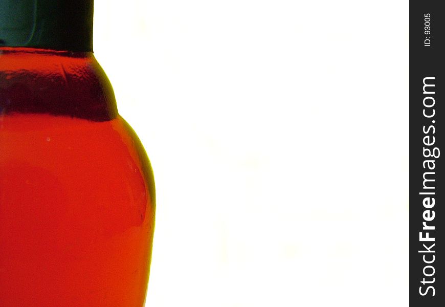 Close up of bottle of red wine against white background. Close up of bottle of red wine against white background