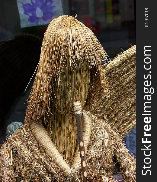 Straw angel with a flute