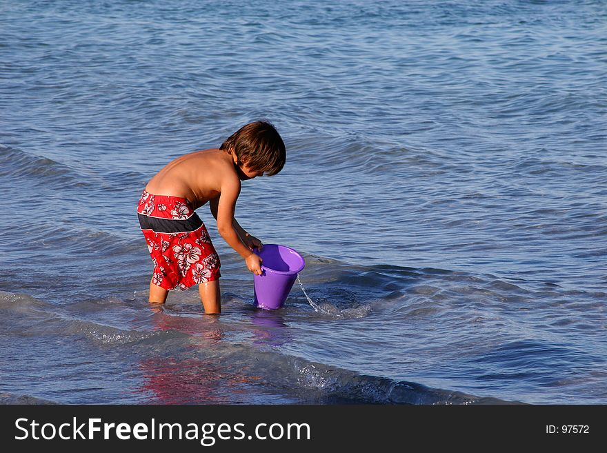 Boy Playing on the Beach.