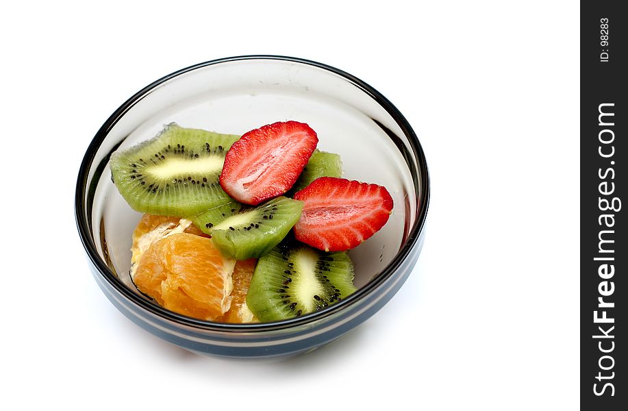 Sliced strawberry, orange and kiwi in a bowl, isolated. Sliced strawberry, orange and kiwi in a bowl, isolated.