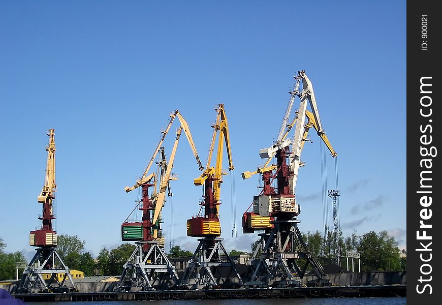 Lifting cranes in the port. Lifting cranes in the port.