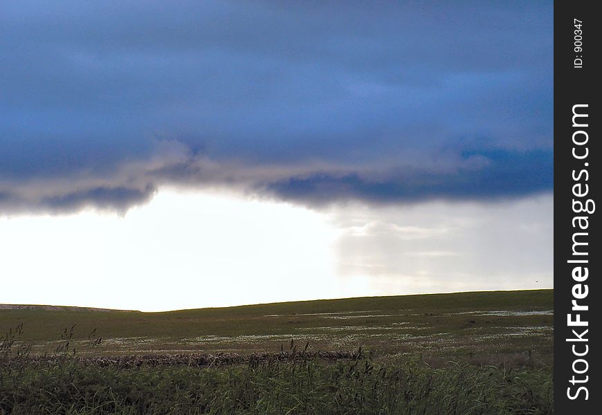 The back edge of a weather front showing the precipitation and clearer skies beyond. The back edge of a weather front showing the precipitation and clearer skies beyond.