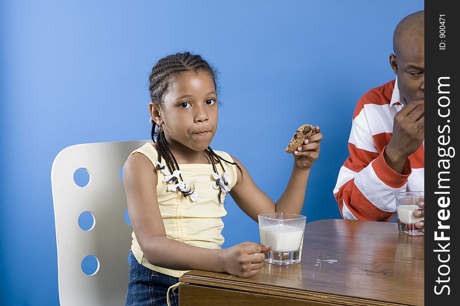 Girl with cookie and milk. Girl with cookie and milk