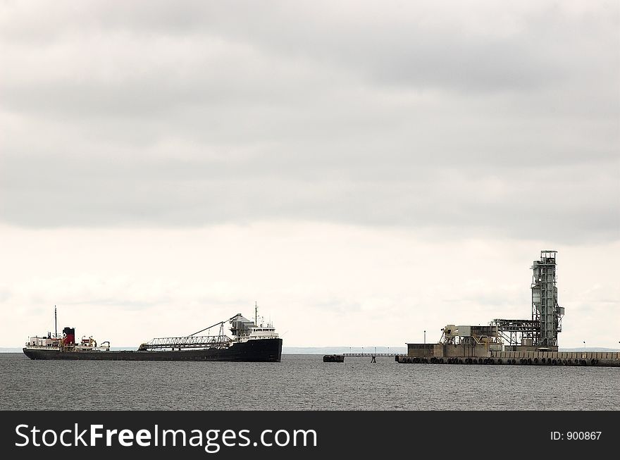 Cargo ship comes into port on Lake Ontario. Cargo ship comes into port on Lake Ontario