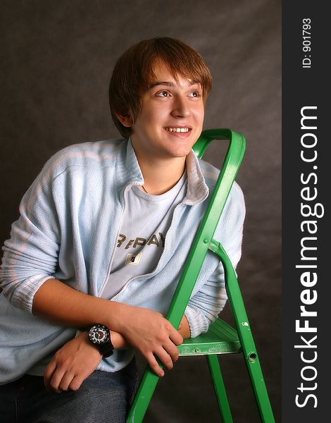 The young man with a green step-ladder