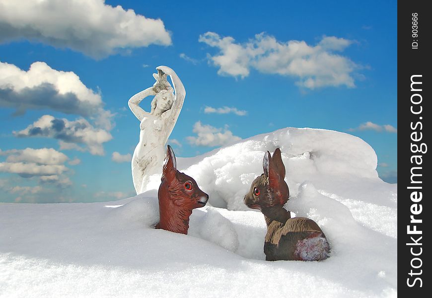 Strange Wintersituation with halfdigged sculpture and plastic deers. Strange Wintersituation with halfdigged sculpture and plastic deers