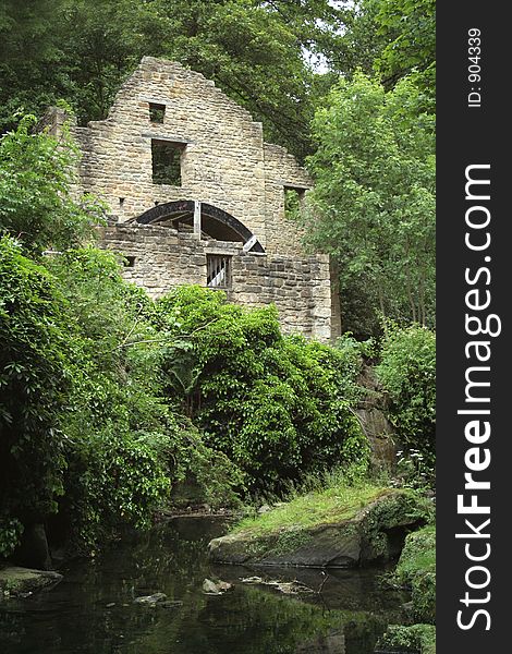 Old disused water mill in a dene in Jesmond, Northumberland, England