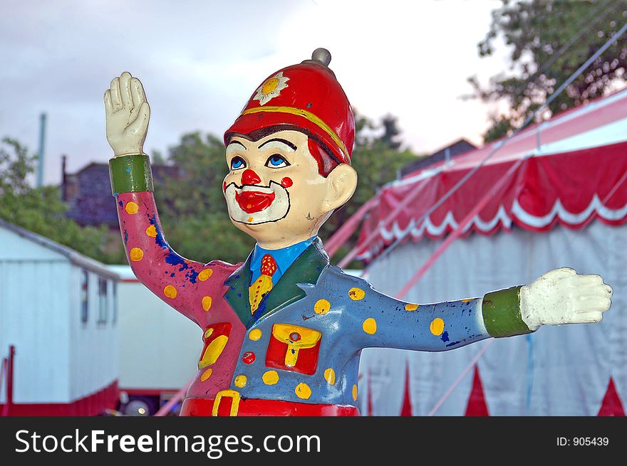 On the entry of a circus a Clown Police makes his job...