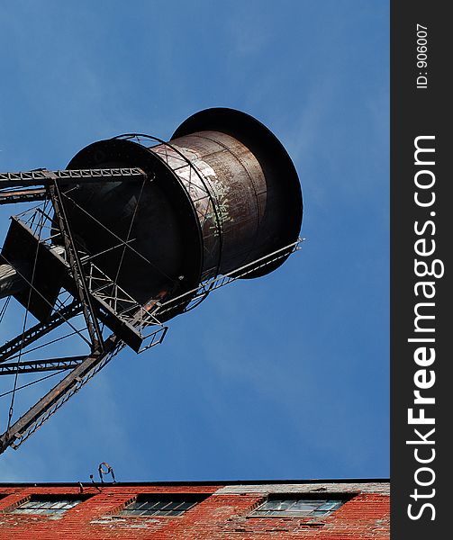 Old water tank beside lofts building in Montreal, Canada. Camera: Nikon D50 with portrait lens (50mm). Old water tank beside lofts building in Montreal, Canada. Camera: Nikon D50 with portrait lens (50mm).